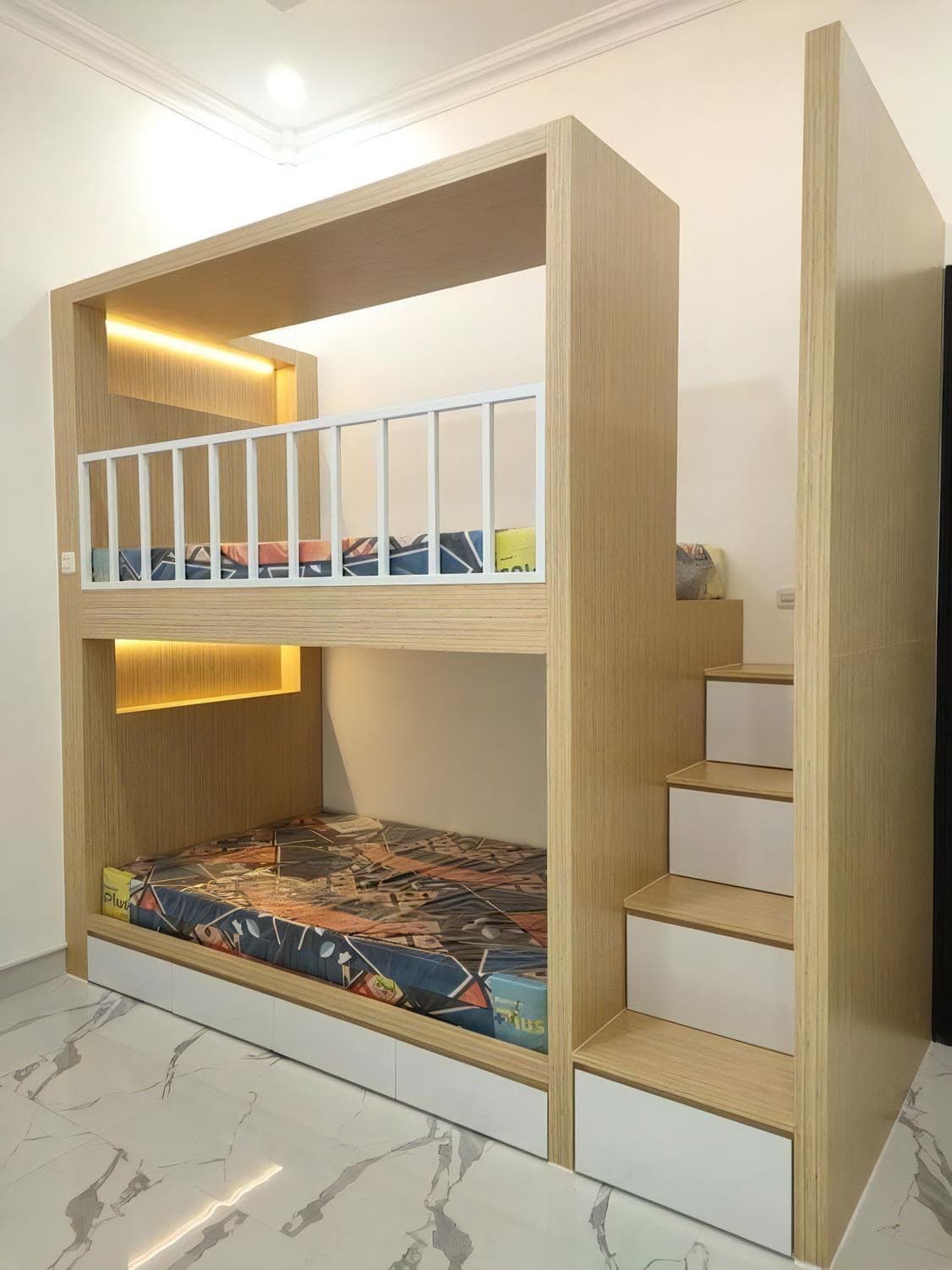Custom built-in bunk bed with storage stairs
