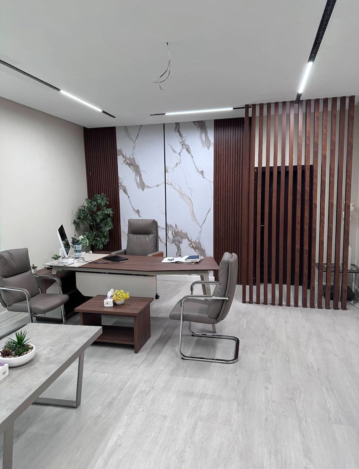Executive office with marble feature wall and wood slat partition